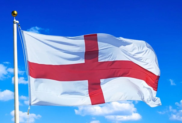 If you were sailing a grand cartoon ship, whose colors would this red cross on a crisp white backdrop represent?