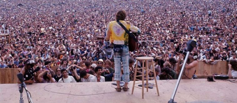 Picture a massive, muddy dairy farm in New York back in 1969, packed with half a million happy campers celebrating peace, love, and rock 'n' roll. What legendary music festival was this?