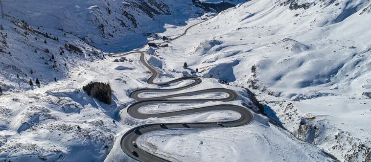 Imagine your toon-mobile is chugging up a steep, twisting peak in Europe’s snowy Alps. What's the best strategy to keep from spinning off-screen?