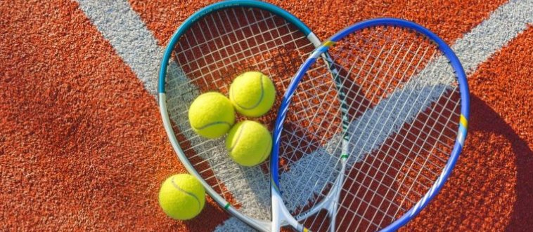Imagine a neon green court, a tightly strung racket, and a bright, fuzzy yellow ball bouncing over a net. What game are we playing?