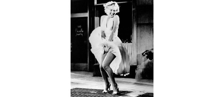 Picture a classic scene: a breezy subway grate and a flying white halter dress!